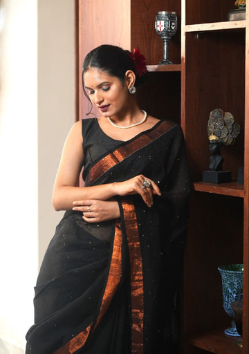 Mahika| Black linen saree with golden zari & sequin highlights