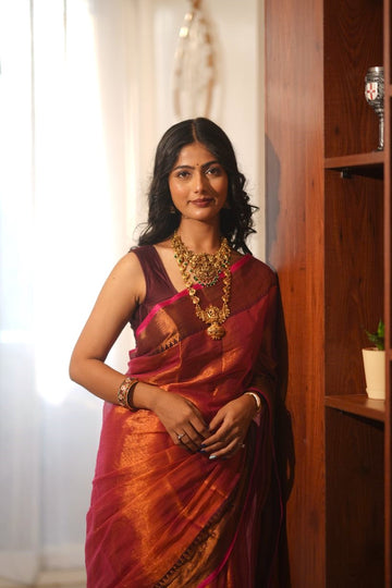 Inira| Pink handwoven tissue saree with Temple Border