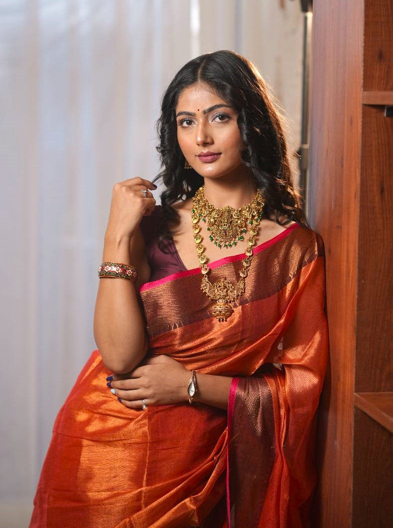 Chitra | Metallic Orange handwoven tissue saree with Temple Border
